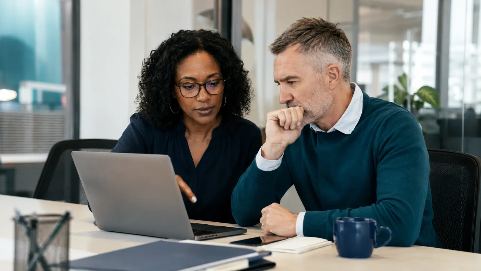 A salesperson and sales leader reviewing a recovered opportunity with account context